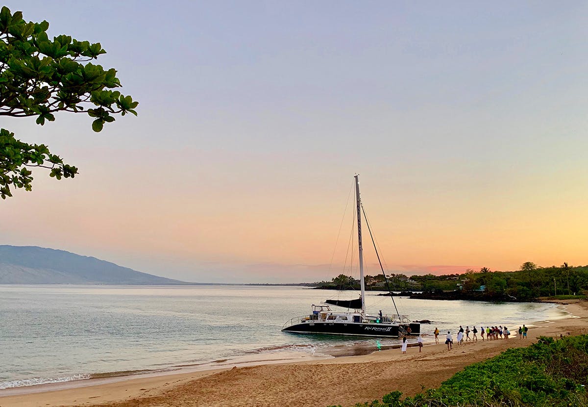 a boat sitting next to a body of water