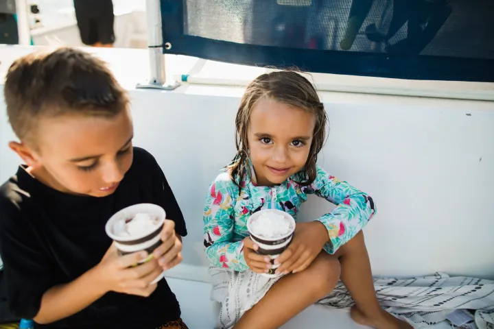 a small child sitting on a table
